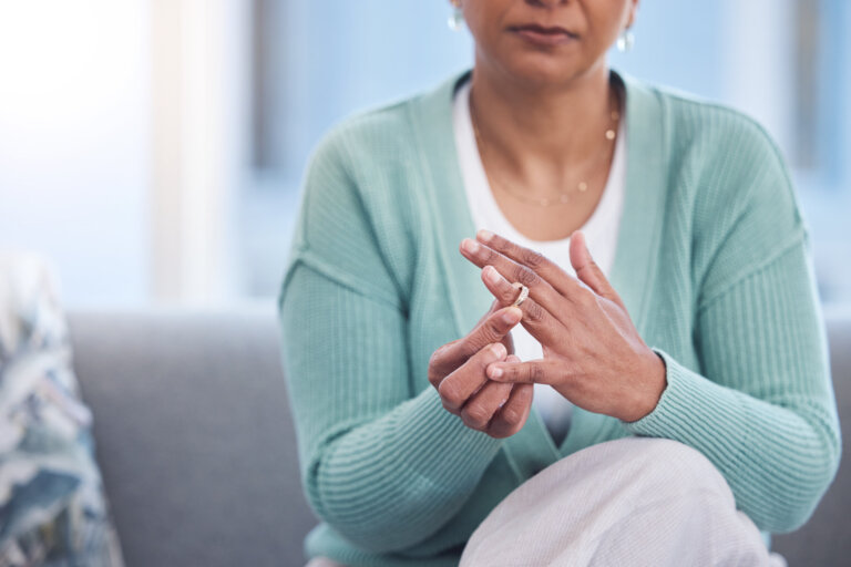 woman taking off her wedding ring